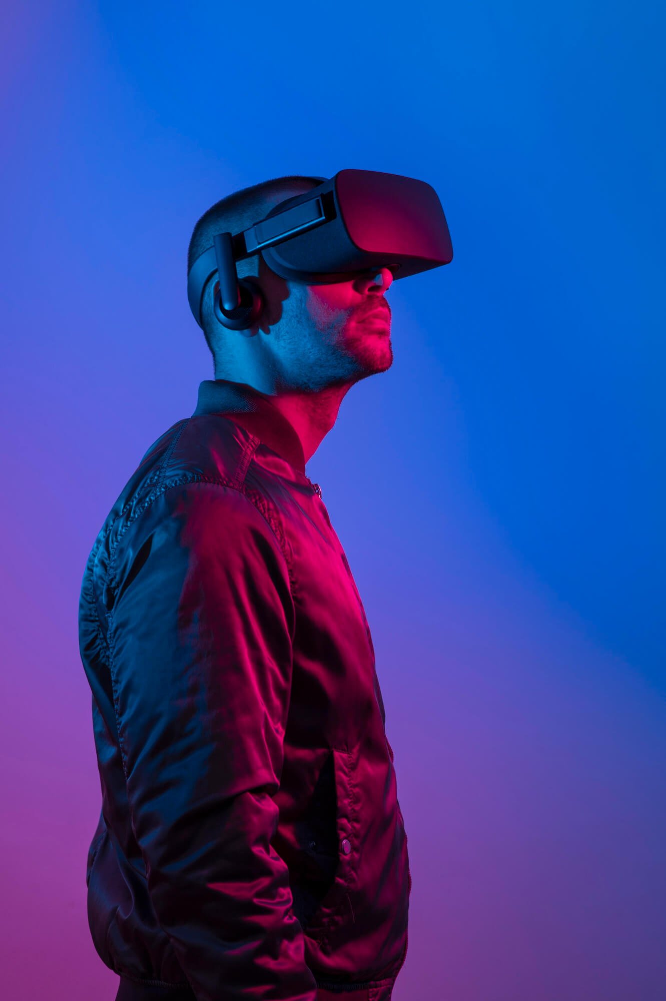 man-wearing-vr-glasses-with-blue-purple-light